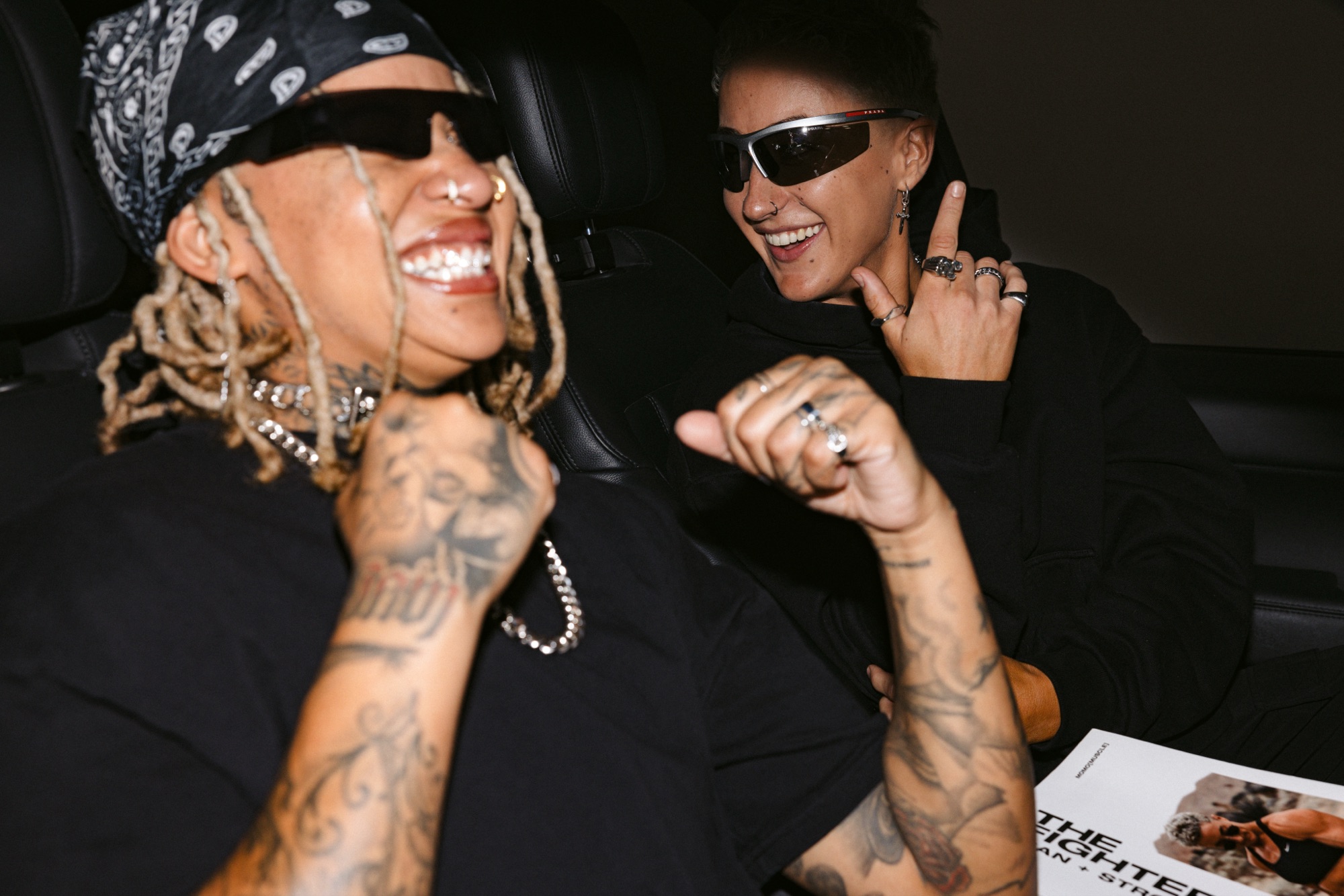 SBA friends laughing in a car at night